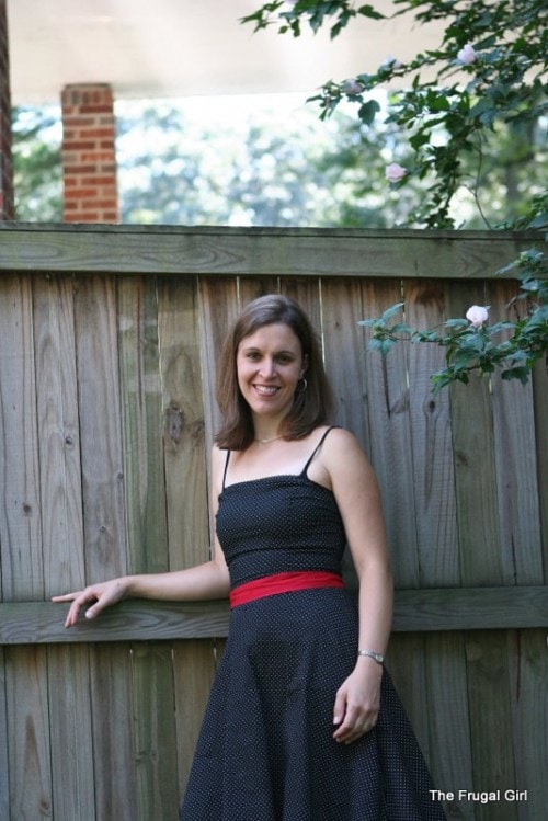 Kristen standing next to a fence.